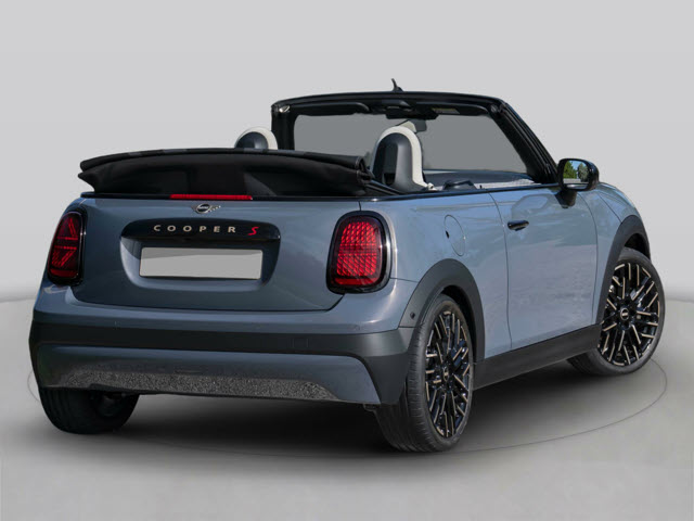 A light blue MINI Cooper S Convertible parked, showcasing its sleek design and black wheels.