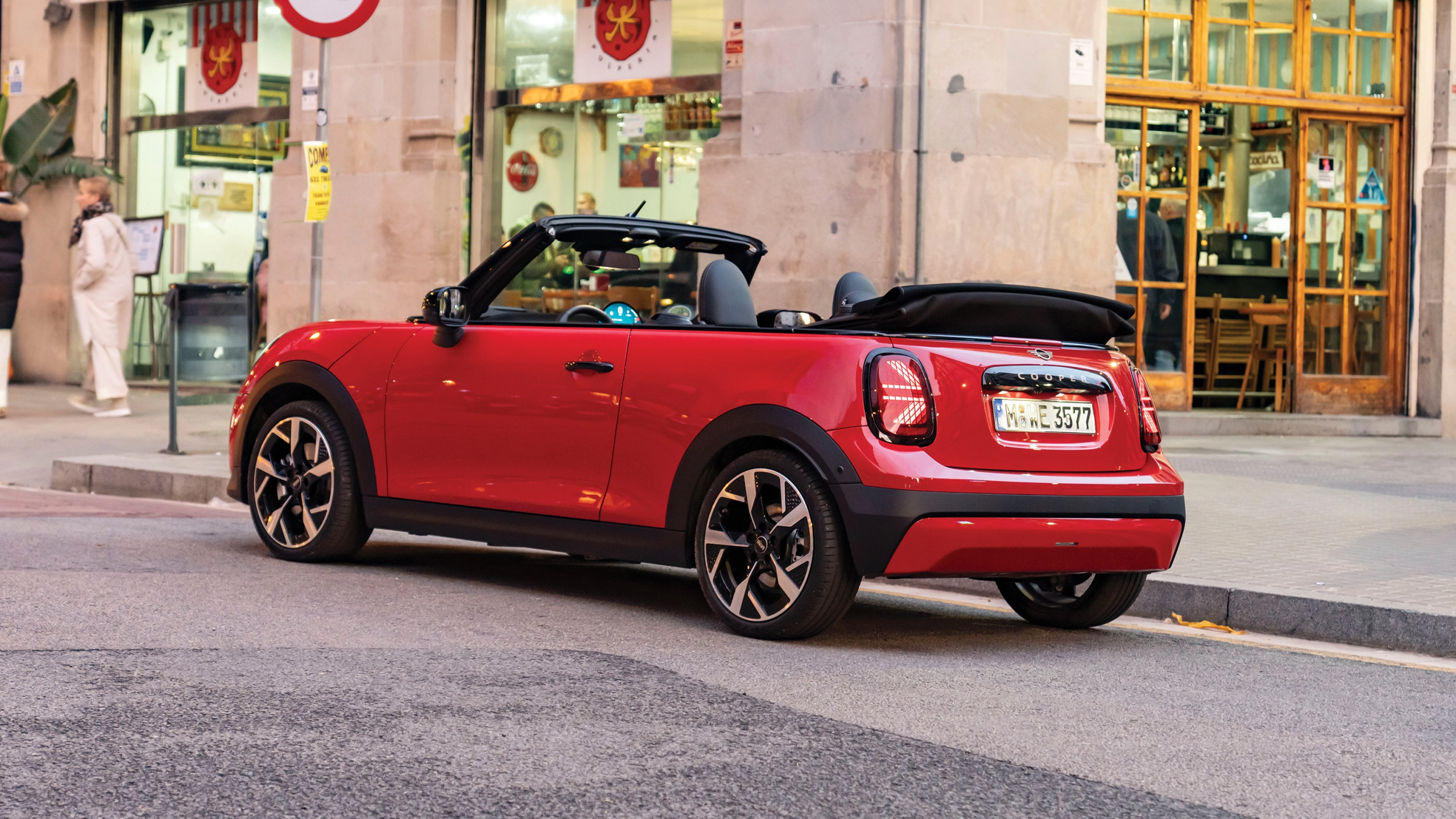 2026 MINI Convertible Iconic with Union Jack soft-top roof on the road
