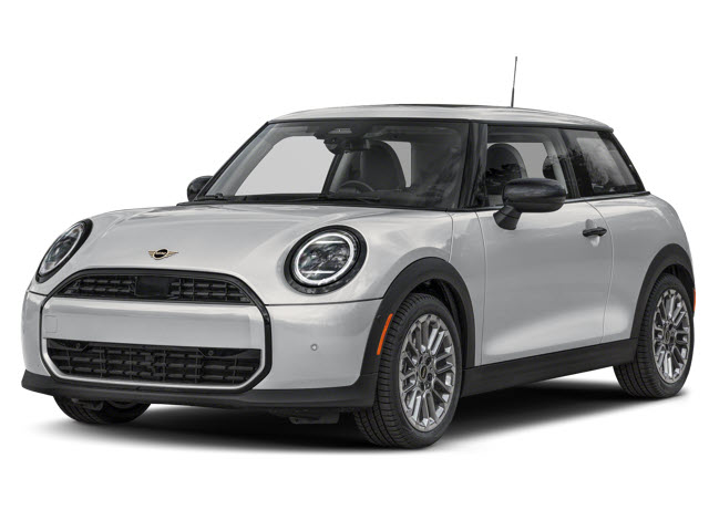 A silver MINI Cooper parked, showing its compact design and round headlights.