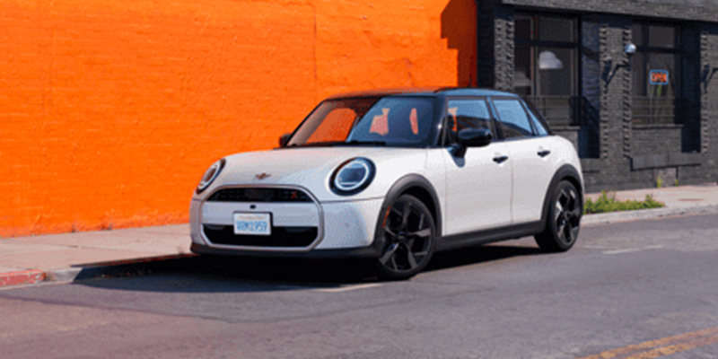 A white 2026 MINI Hardtop 4 Door parked on the roadside in Morristown, NJ.