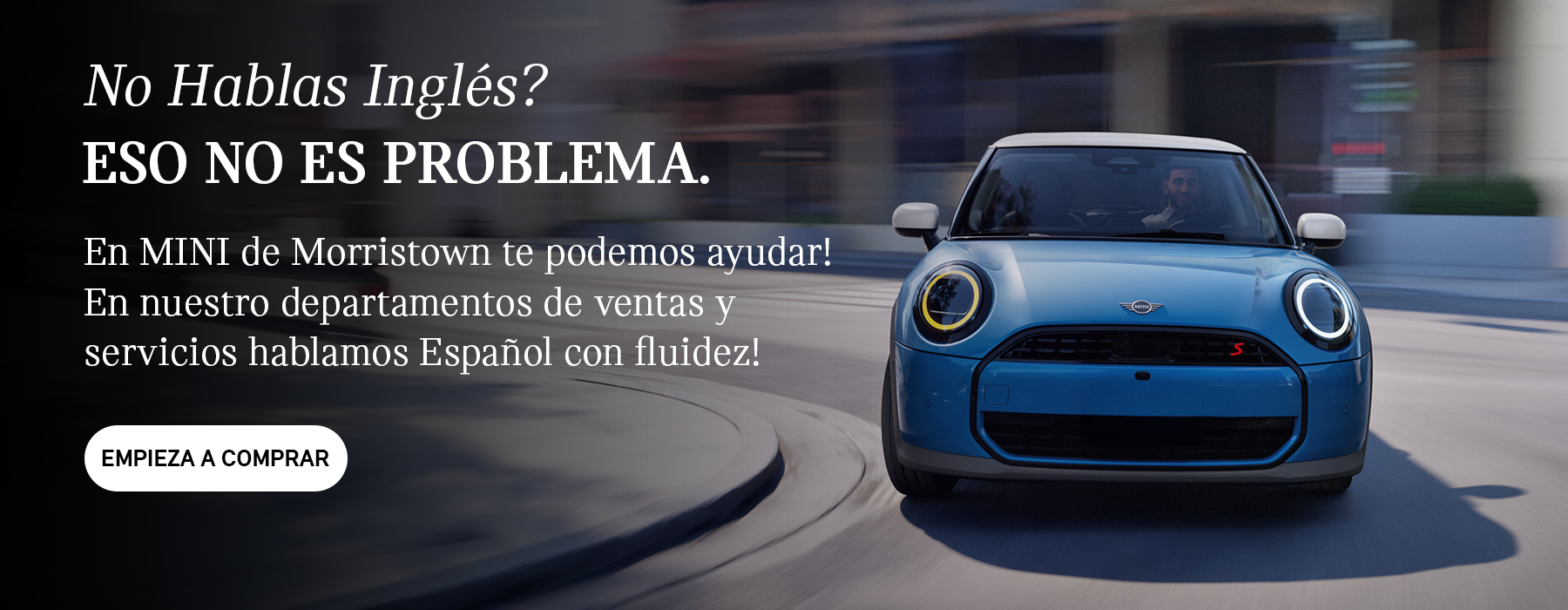 Front view of grey MINI Countryman with blue background.