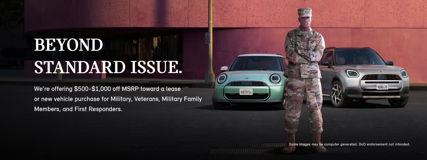 front view of two MINI coopers infront of pink wall.