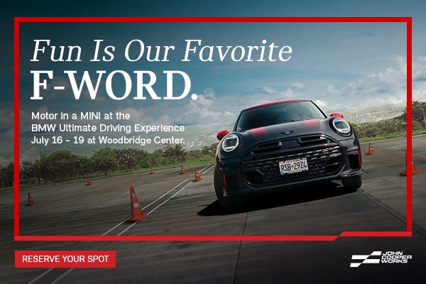Black JCW driving.